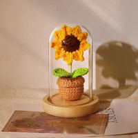 knitted potted plant with glass cover
